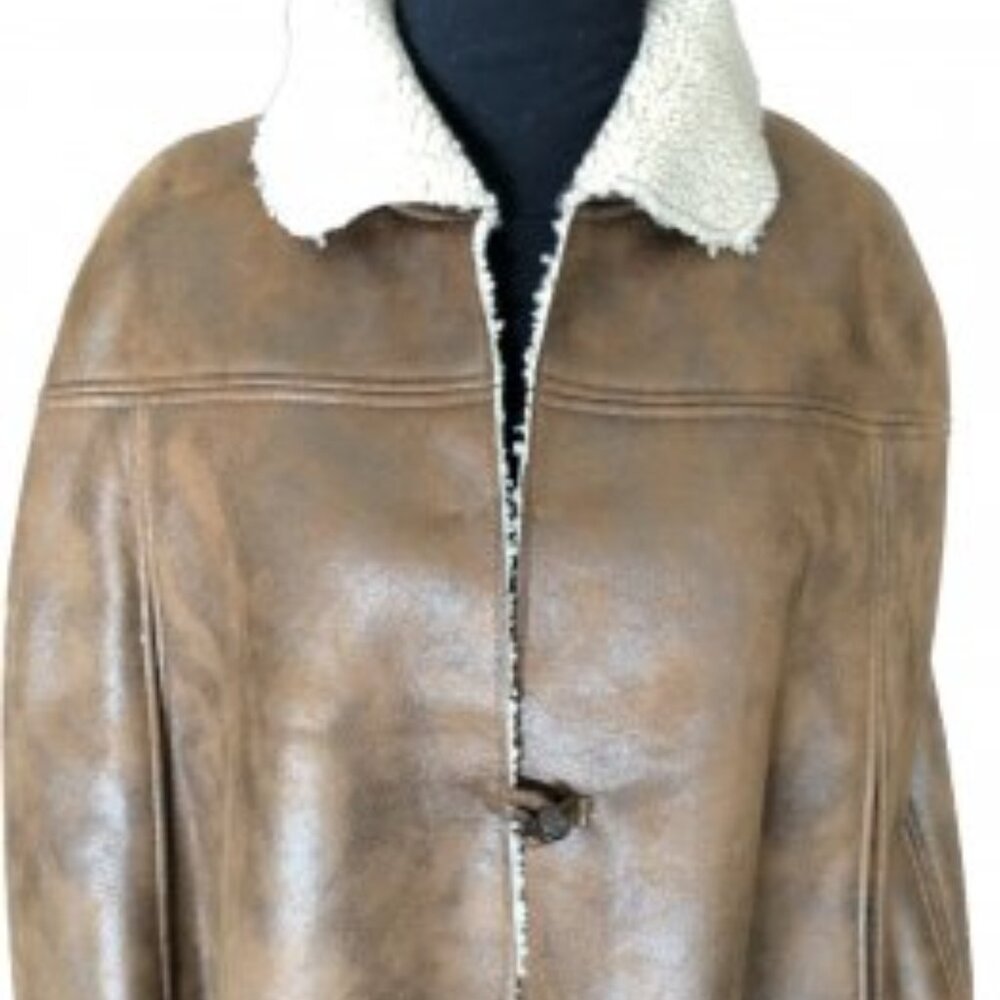Faux shearling cape Designed by Cedric’s